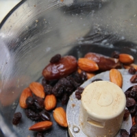 Step 2 - Process in three parts in food processor: dates, almonds, raisins.  Slowly adding coconut, pumpkin seeds, and sunflower seeds. Pulse & scrape the sides of the food processor.