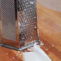 Step 4 - Use a grater to shred coconut