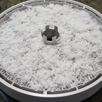 Step 7 - Spread shredded coconut evenly on tray