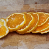 Step 2 - Wash skin and slice Clementines