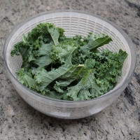Step 1 -  Wash kale leaves and tear into pieces, discarding stems. Dry in salad spinner